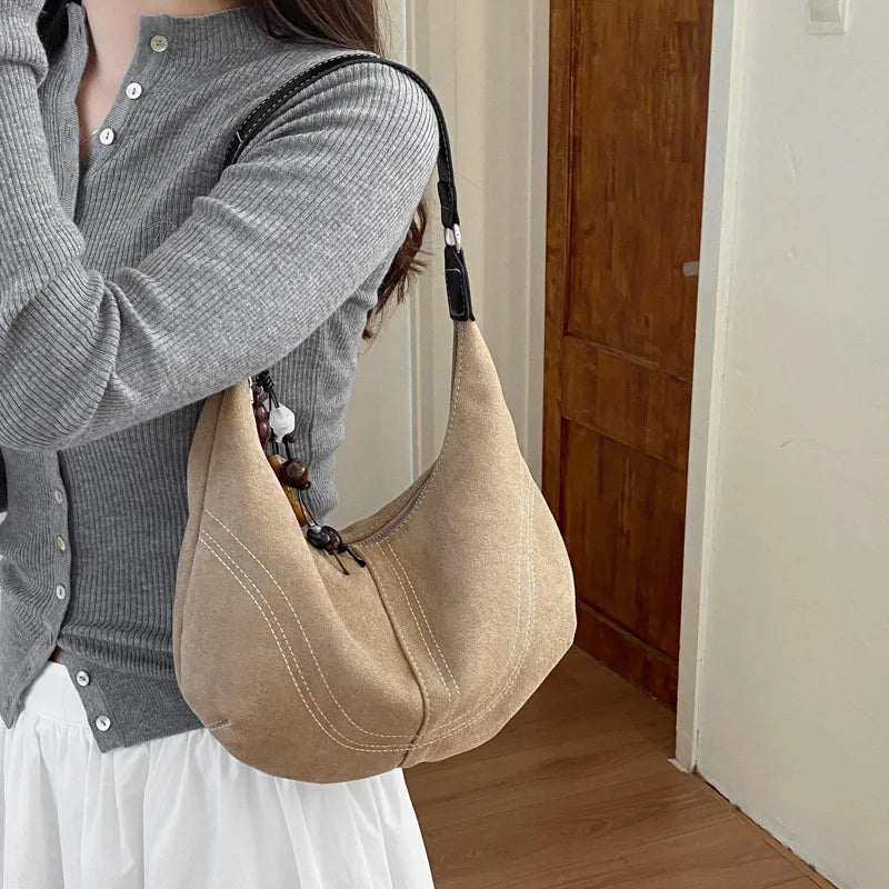 The Suede-Look Dumpling Bag, product photograph for the SIX7 handbag collection